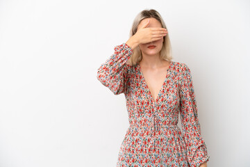 Young caucasian woman isolated on white background covering eyes by hands. Do not want to see...