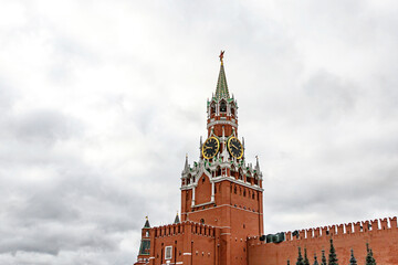 Kremlin tower against heavy gray clouds. Moscow, Russia.