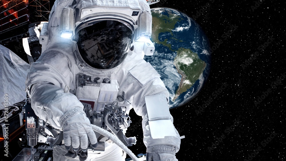 Wall mural astronaut spaceman do spacewalk while working for spaceflight mission at space station . astronaut w