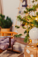 Wooden sled under christmas tree. Scandinavian christmas tree.