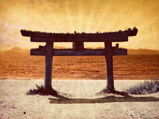 Stone tori gate on the beach at Naoshima in Japan