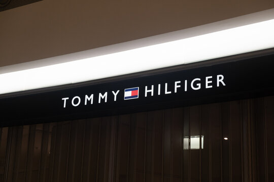 Moscow, Russia - September, 2020: Tommy Hilfiger sign. Tommy Hilfiger  wrapping paper background, blue tone Stock Photo