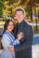 Fototapeta premium Close up portrait of a happy couple in an autumn park