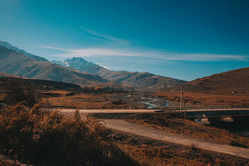 A bridge over a mountain river. Mountain landscape in North Ossetia