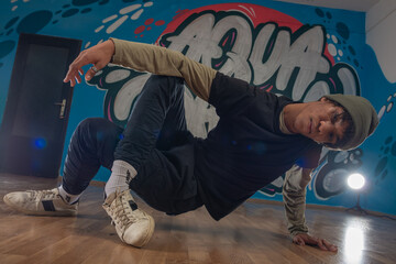 Obraz na płótnie Canvas Modern rapper dancing in garage. Urban lifestyle, hip hop.