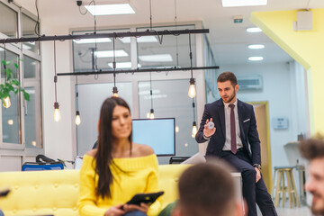 Multiethnic group of employees working in a google environment company. Group of colleagues working on a project in modern offices