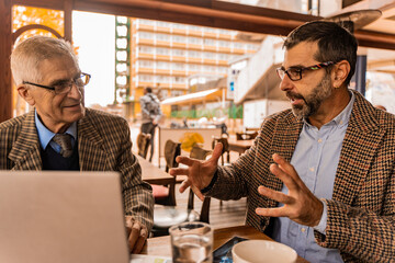 Talking on their meeting in the cafe while sitting