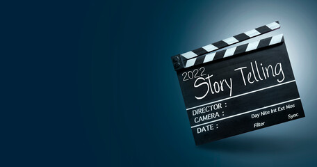 2022 storytelling, Handwriting on film slate or movie clapper board. Filming movies with amazing...