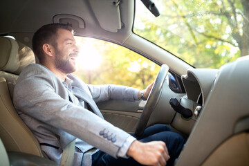 Smiling man in his car