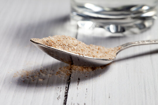 Medicinal Isabgol or psyllium husks with a spoon