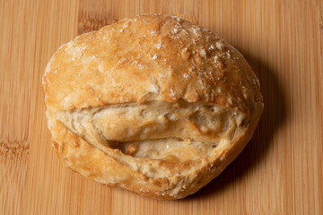 French bread, served on a wooden table for breakfast, close up photo