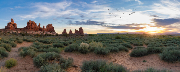 red rocks in arches national park with clouds