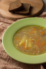 A plate of meat soup. Delicious broth. Lunch