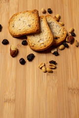 toast, a mix of chestnuts for breakfast on a wooden table, horizontal photo taken from above, space for text