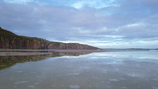 4K Beach landscape of the beach and sea, cloudy day in Scotland