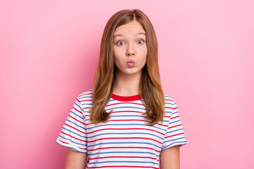 Photo of flirty teenager girl blow kiss wear red t-shirt isolated on pink color background