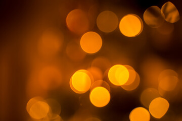 Blurry bokeh light from Christmas tree garland. Defocused abstract Christmas light