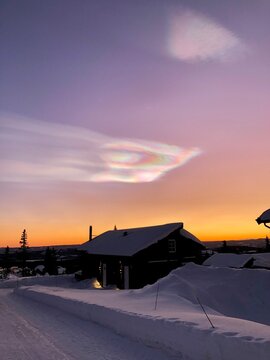 Sunset In The Mountains With A Beautiful Polar Stratospheric Cloud Shining Above