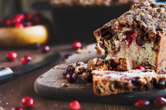 Rustic image of homemade cranberry sweet bread for Christmas. Selective focus with blurred foreground and background.