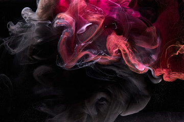 Pink smoke on black ink background, colorful fog, abstract swirling touch ocean sea, acrylic paint pigment underwater © amixstudio