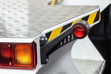 rear lights and brake lights of the hydraulic lift. Focus on rear lights