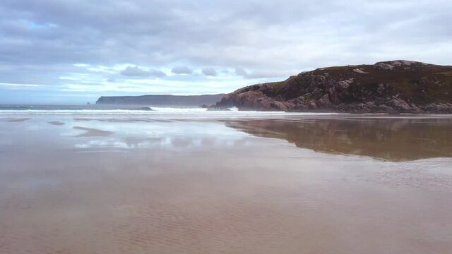 4K Beach landscape of the beach and sea, cloudy day in Scotland