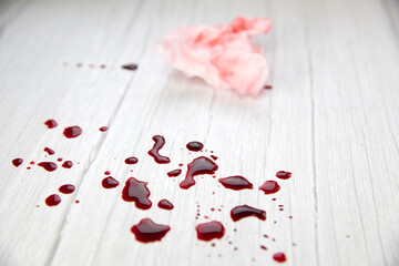 blood stains on white wooden background, dripped and splatterd blood with copy space, injury wound,...