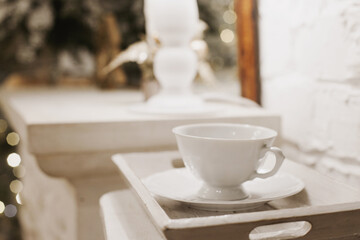 Fototapeta na wymiar white cup of coffeei the living room