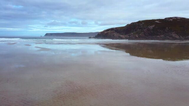 4K Beach landscape of the beach and sea, cloudy day in Scotland

