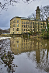 Salt's Mill Reflected in the River Aire in West Yorkshire