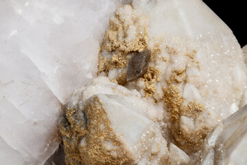 Macro mineral stone Snow quartz with calcite on a black background