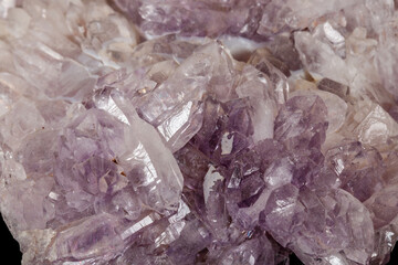 Macro of amethyst mineral stone on black background
