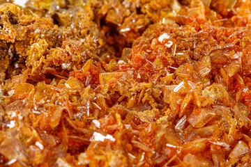 Macro stone mineral Wulfenite on a white background
