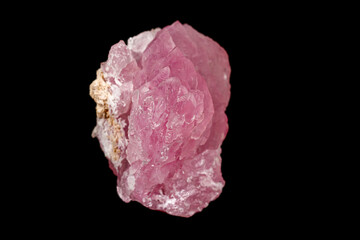 Macro pink quartz mineral stone on black background