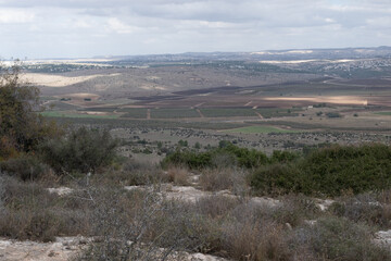 View towards the North of Ayalon Valley and agriculture fields as seen from one of Ayalon-Canada National Park northeastern panoramic hilltops, Israel.
