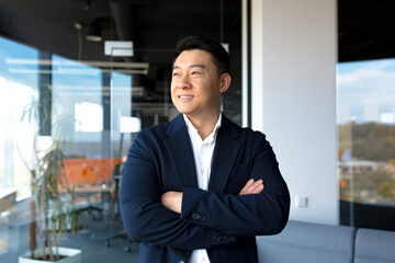 Portrait of successful business owner male boss asian cheerful happy smiling and rejoicing in...