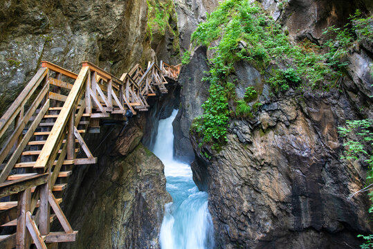 Walking through the Sigmund-Thun Klamm with wooden walkways near Kaprun in Salzburg, Austria