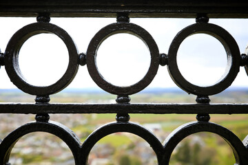close up view of circular shaped iron railings