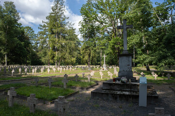 Lambinowice, Poland - August 21, 2021:  Cemetery of prisoners of war from first and second world war. Soviet, german, serbian, italian, french, commonwealth, romanian. Summer day.  Selective focus