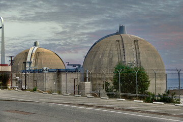nuclear power plant on the shoreline at sunset