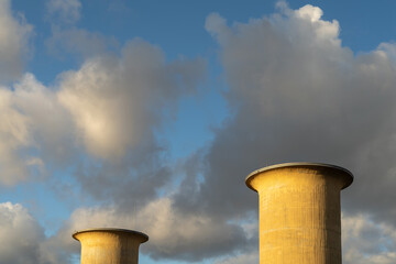Two Exhaust Air Towers against Cloudy Sky