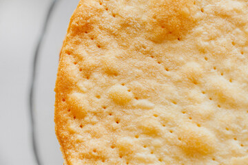 Texture of baked crumpets cakes made of puff pastry for cake. Semi-finished product for cake.