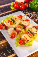 Colorful Food Appetizer Starts Snacks Fresh Delicious Menu Recipe Meal Meat Chicken Fries Fish Seafood Beer on a wooden table on the Beach