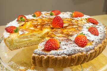 Apple pie with cranberry, meringue, icing sugar and shortcrust pastry (front)