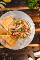 Colorful Food Appetizer Starts Snacks Fresh Delicious Menu Recipe Meal Meat Chicken Fries Fish Seafood Beer on a wooden table on the Beach