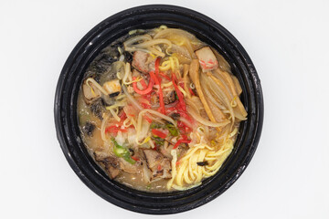 Delicious Japanese Style Buta Ramen in a Black Bowl with a White Background
