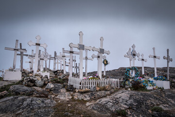 Graveyard with white crosses on the arctic tundra; cemetery of Ilulissat, Greenland