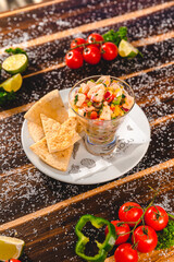 Colorful Food Appetizer Starts Snacks Fresh Delicious Menu Recipe Meal Meat Chicken Fries Fish Seafood Beer on a wooden table on the Beach
