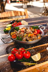 Colorful Food Appetizer Starts Snacks Fresh Delicious Menu Recipe Meal Meat Chicken Fries Fish Seafood Beer on a wooden table on the Beach