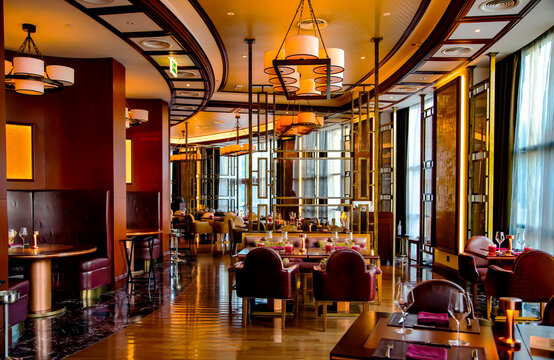 UAE, RAS AL KHAIMAH, NOVEMBER, 2021 - Restaurant interior in Waldorf Astoria 5 star luxury hotel at Ras al Khaimah, United Arab Emirates